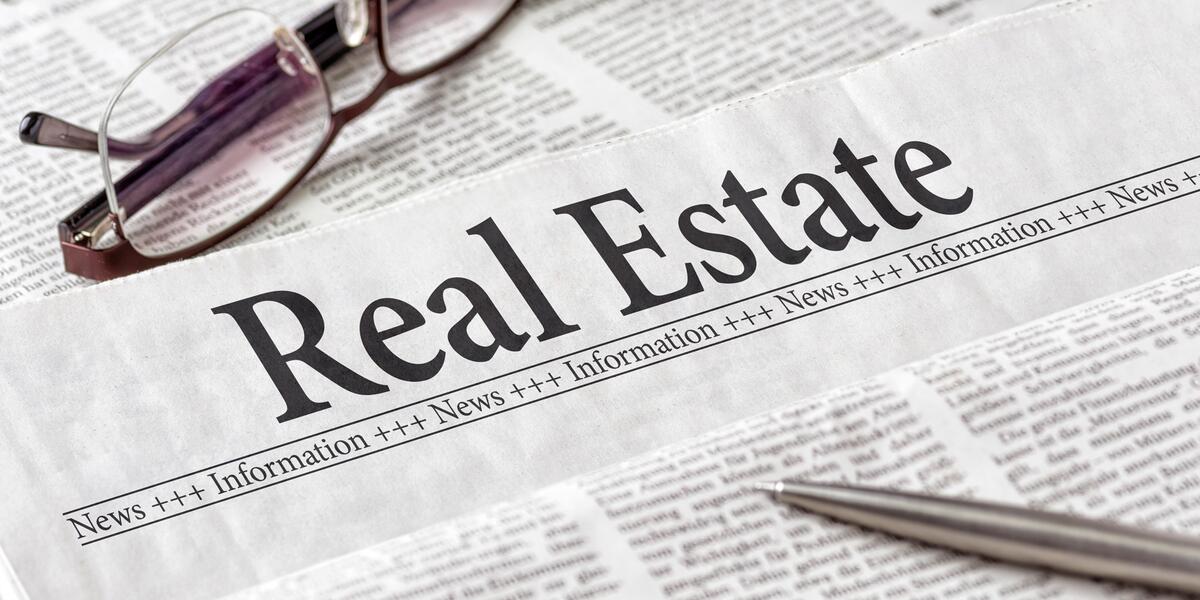 close-up-newspaper-with-heading-real-estate